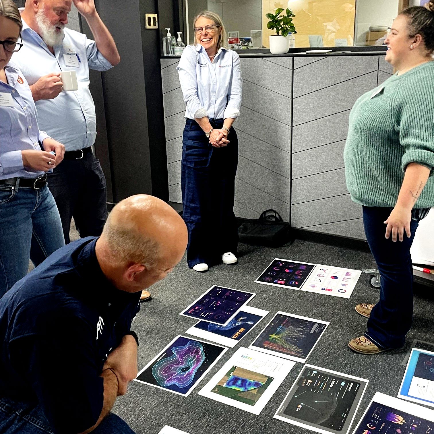 BreedLogic workshop with participants working through printed interface concepts